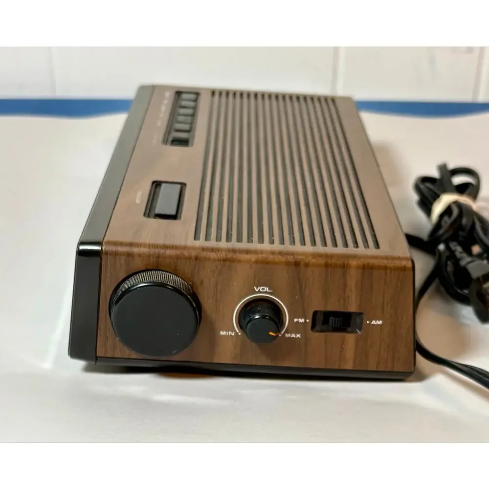 Vintage Lloyds Model J274A Clock Radio Simulated Wood Grain Plastic- clock only